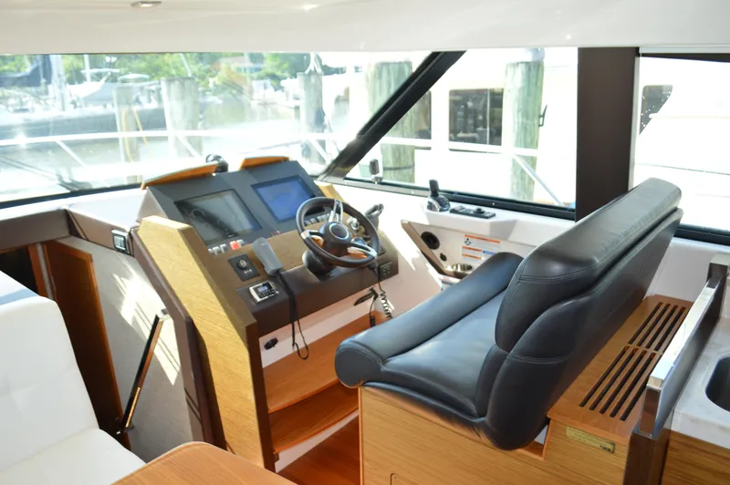 Andros Yacht Photos Pics 2016 Tiara Yachts C44 Coupe helm with modern controls and leather seating.
