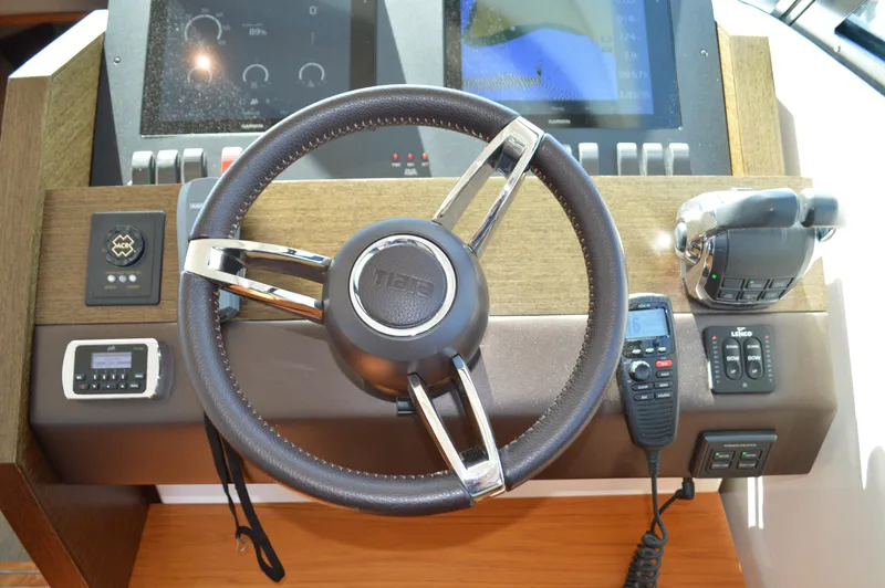 Andros Yacht Photos Pics Steering wheel and controls of 2016 Tiara Yachts C44 Coupe.