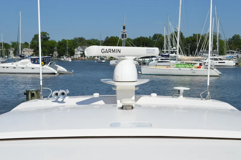 Andros Yacht Photos Pics 2016 Tiara Yachts C44 Coupe with Garmin radar in a marina setting.