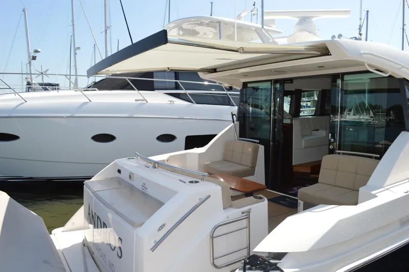 Andros Yacht Photos Pics 2016 Tiara Yachts C44 Coupe with open deck and luxurious seating at marina.