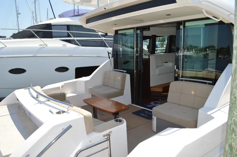 Andros Yacht Photos Pics 2016 Tiara Yachts C44 Coupe with spacious outdoor seating and elegant interior design.