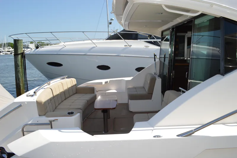 Andros Yacht Photos Pics 2016 Tiara Yachts C44 Coupe with spacious seating area and sleek design.