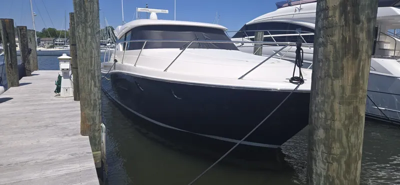 Andros Yacht Photos Pics 2016 Tiara Yachts C44 Coupe docked at marina, sleek design, sunny day.