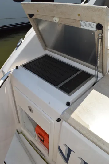 Andros Yacht Photos Pics Outdoor grill on 2016 Tiara Yachts C44 Coupe, open lid, sleek design.