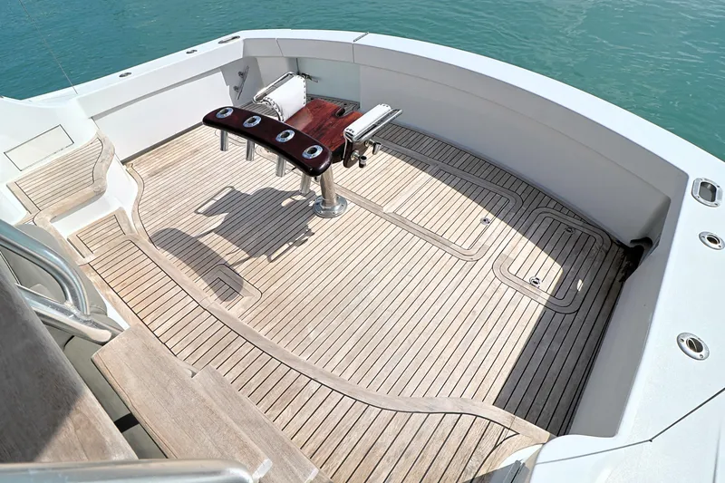  Yacht Photos Pics 2004 Hatteras 54 Convertible yacht deck with fishing chair and rod holders.