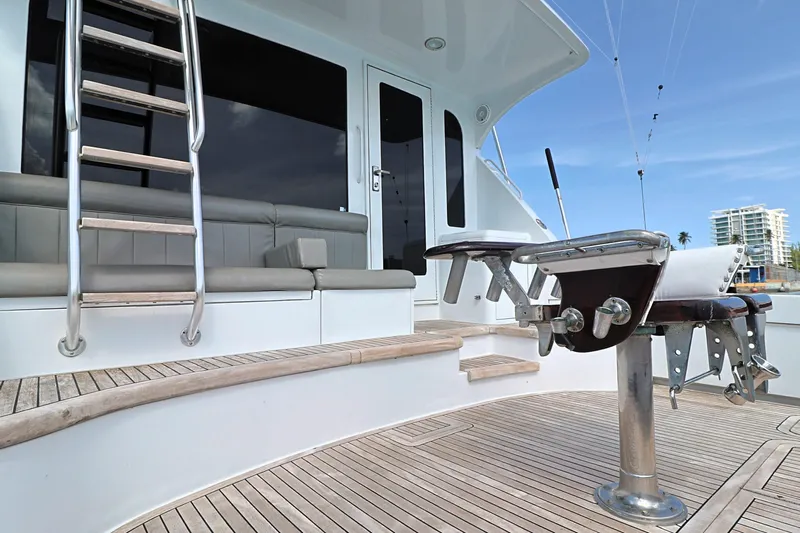  Yacht Photos Pics 2004 Hatteras 54 Convertible yacht deck with seating and fishing equipment.