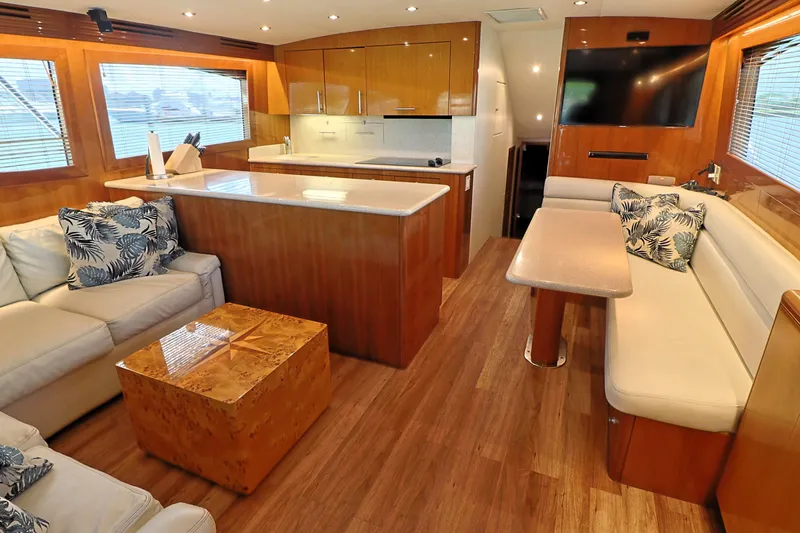  Yacht Photos Pics Luxurious interior of 2004 Hatteras 54 Convertible yacht with modern furnishings.