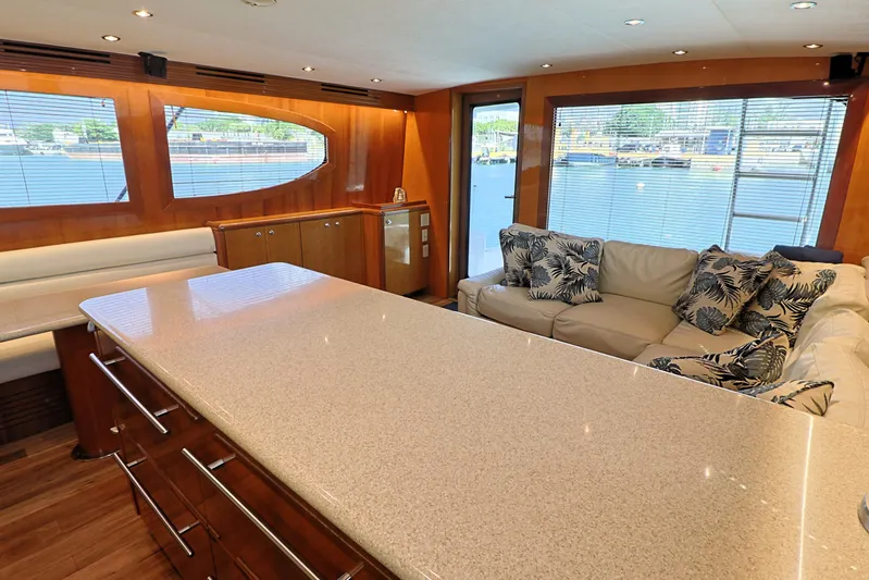  Yacht Photos Pics Luxurious interior of 2004 Hatteras 54 Convertible yacht with modern furnishings and waterfront view.