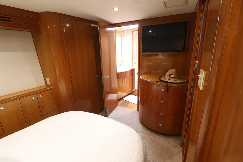  Yacht Photos Pics Luxurious cabin interior of 2004 Hatteras 54 Convertible yacht with wood finish.