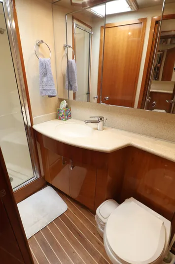  Yacht Photos Pics Luxurious bathroom in 2004 Hatteras 54 Convertible yacht with modern fixtures.