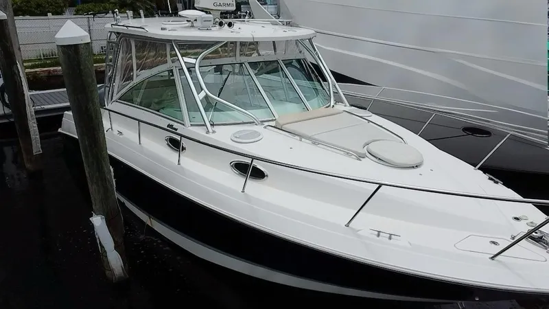  Yacht Photos Pics 2014 Wellcraft 340 Coastal boat docked, featuring sleek design and spacious deck.