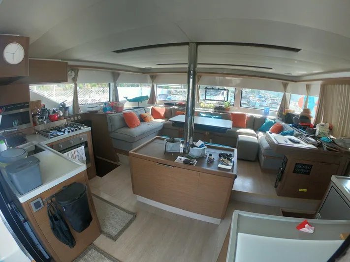  Yacht Photos Pics Spacious interior of 2019 Lagoon 50 catamaran with modern furnishings and ample seating.