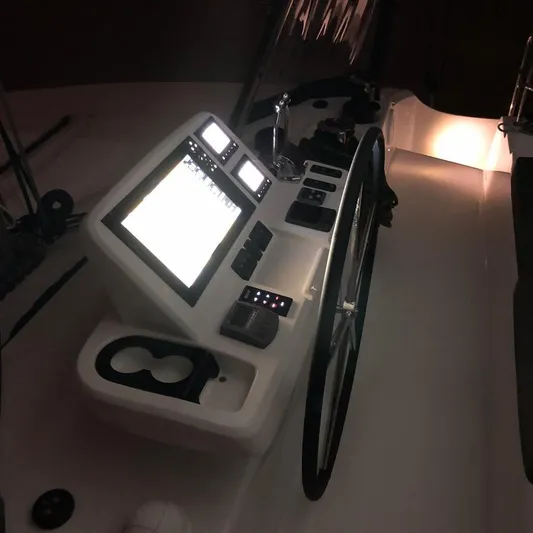  Yacht Photos Pics Helm station of 2019 Lagoon 50 catamaran with illuminated navigation screens.