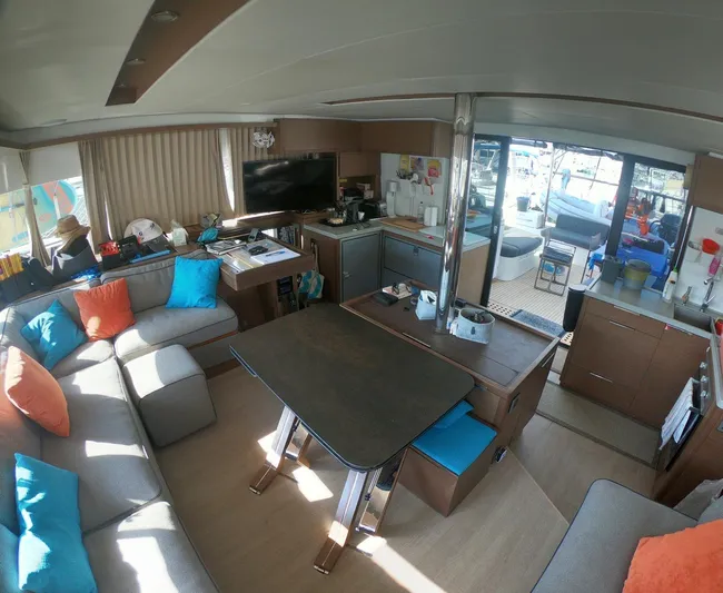  Yacht Photos Pics Interior of 2019 Lagoon 50 yacht with modern kitchen and cozy seating area.