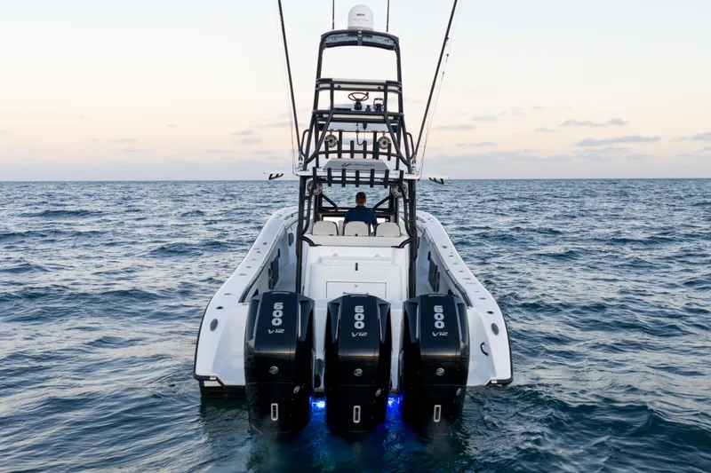  Yacht Photos Pics 2023 Yellowfin 42 Offshore boat with triple 600 V12 engines on open sea.