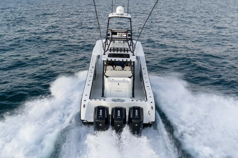  Yacht Photos Pics 2023 Yellowfin 42 Offshore boat cruising on open water with powerful engines.