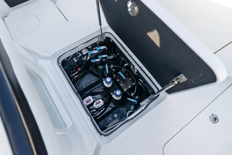  Yacht Photos Pics 2023 Yellowfin 42 Offshore boat compartment with visible wiring and components.