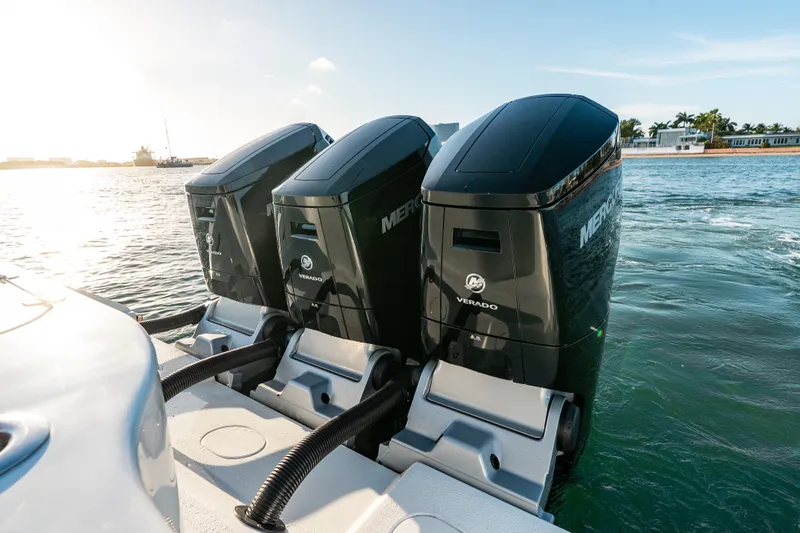  Yacht Photos Pics Triple Mercury Verado engines on 2023 Yellowfin 42 Offshore boat in sunny waters.