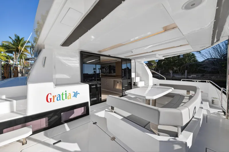  Yacht Photos Pics 2024 Leopard 46 Powercat yacht with outdoor seating and sleek design.