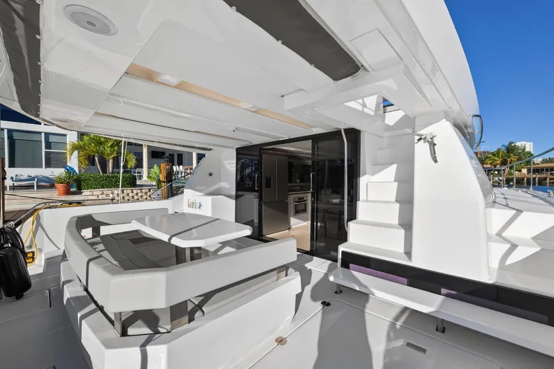  Yacht Photos Pics 2024 Leopard 46 Powercat yacht with modern outdoor seating and sleek design.