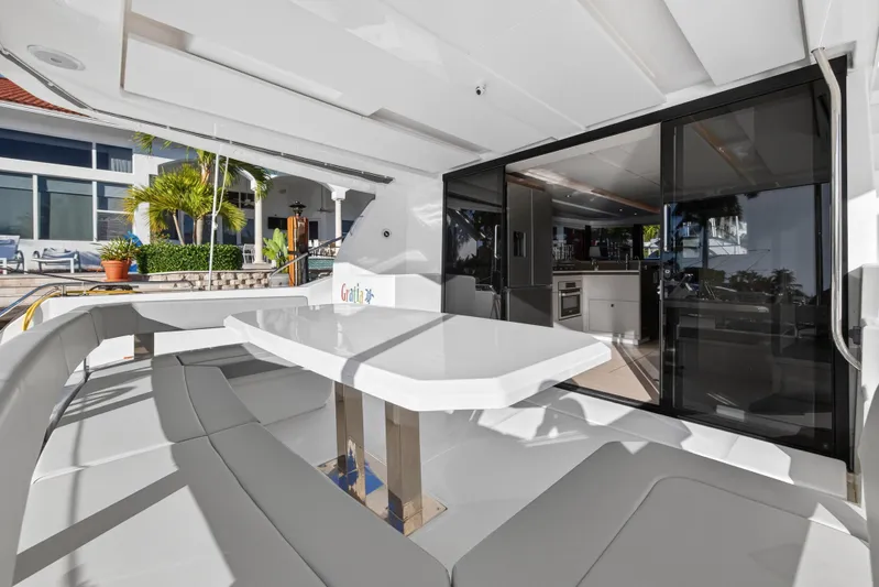  Yacht Photos Pics 2024 Leopard 46 Powercat yacht interior with sleek dining area and modern kitchen.