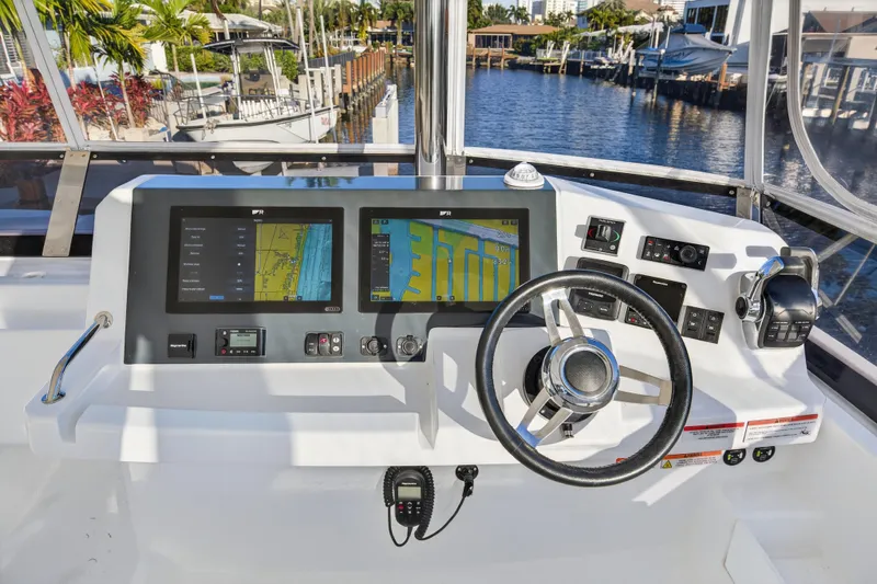  Yacht Photos Pics Helm of 2024 Leopard 46 Powercat with dual navigation screens and steering wheel.