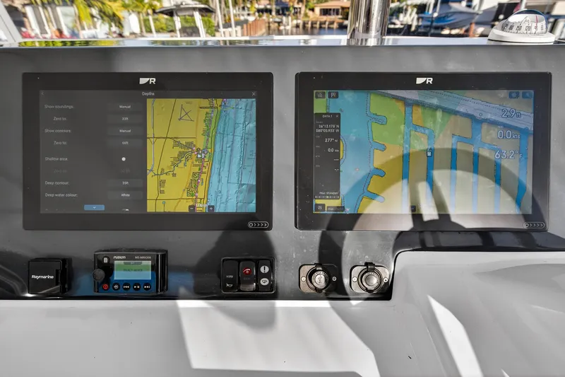  Yacht Photos Pics Navigation screens on 2024 Leopard 46 Powercat, displaying maps and data.