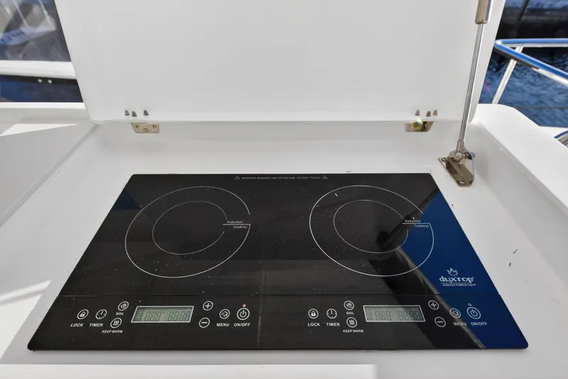  Yacht Photos Pics Induction cooktop on 2024 Leopard 46 Powercat yacht, featuring dual burners and digital controls.