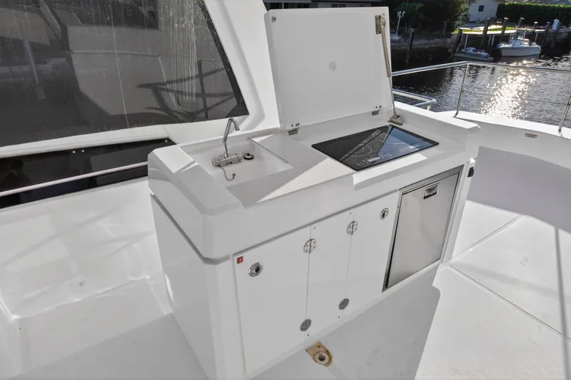  Yacht Photos Pics Outdoor kitchen on 2024 Leopard 46 Powercat yacht with sink and stove.