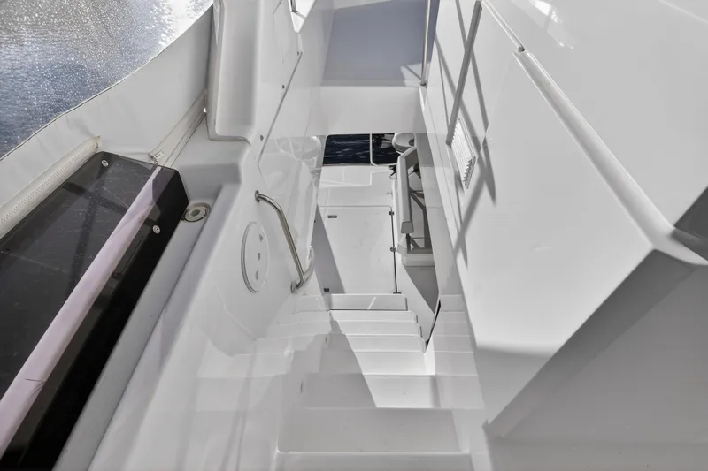  Yacht Photos Pics Staircase on 2024 Leopard 46 Powercat yacht, featuring sleek white design and modern railing.