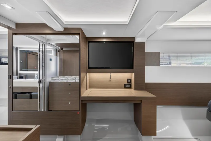  Yacht Photos Pics Modern interior of 2024 Leopard 46 Powercat with sleek wood finishes and built-in TV.