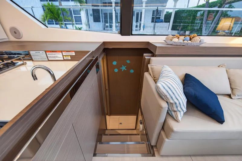  Yacht Photos Pics 2024 Leopard 46 Powercat interior with modern kitchen and cozy seating area.