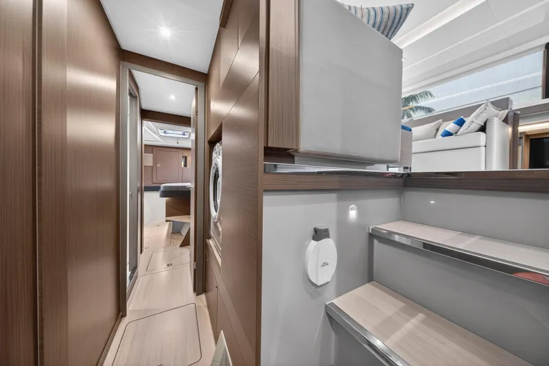  Yacht Photos Pics Luxurious interior of 2024 Leopard 46 Powercat yacht, featuring modern wood finishes and comfortable seating.