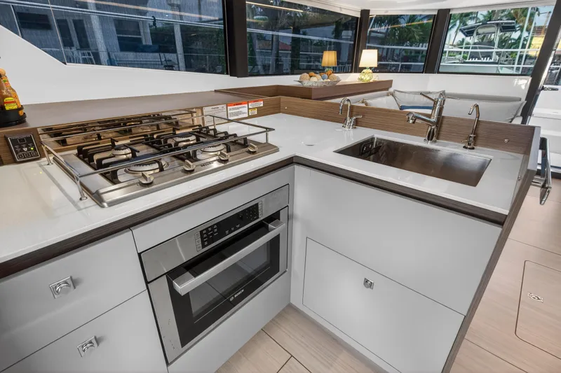  Yacht Photos Pics Modern kitchen in 2024 Leopard 46 Powercat yacht with stove, oven, and sink.