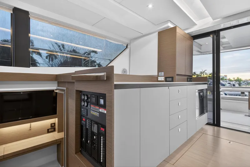  Yacht Photos Pics Modern interior of 2024 Leopard 46 Powercat yacht with sleek cabinetry and control panel.