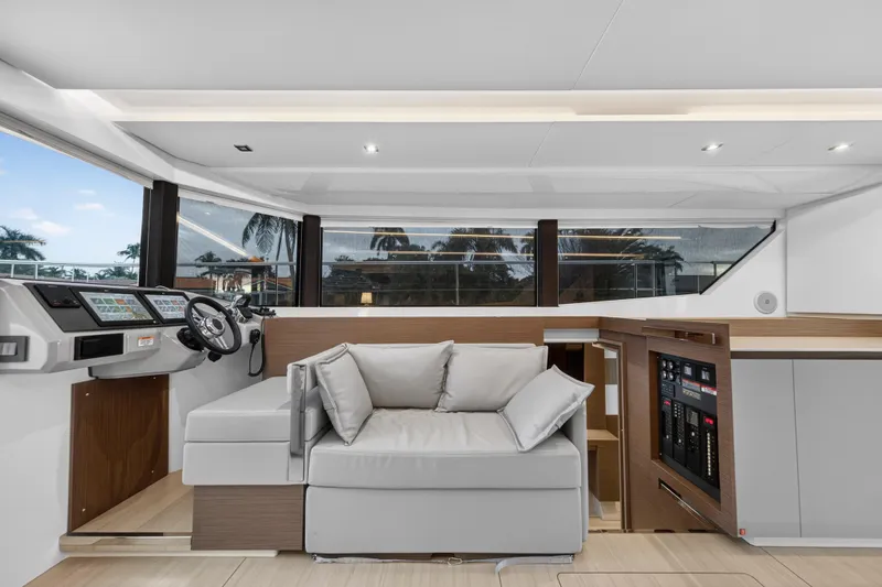  Yacht Photos Pics Luxurious interior of 2024 Leopard 46 Powercat with modern helm and plush seating.