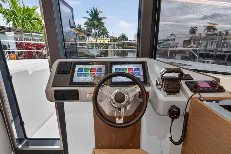  Yacht Photos Pics Helm station of 2024 Leopard 46 Powercat with modern controls and dual displays.