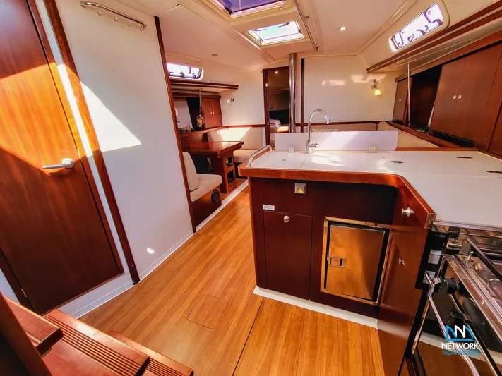  Yacht Photos Pics Interior of 2008 Hanse 400 yacht with modern kitchen and wooden flooring.