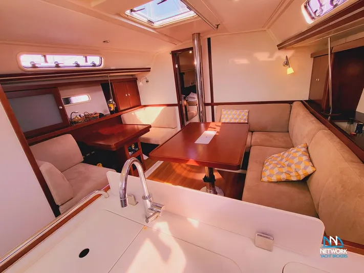  Yacht Photos Pics Luxurious interior of 2008 Hanse 400 yacht with cozy seating and wooden accents.