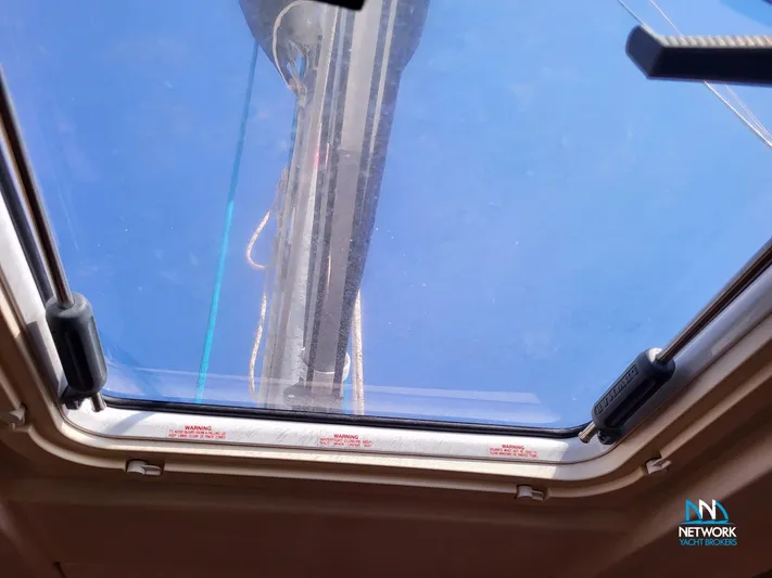  Yacht Photos Pics View through a skylight on a 2008 Hanse 400 sailboat, showing a clear blue sky.