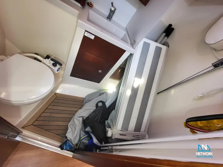  Yacht Photos Pics Compact bathroom in a 2008 Hanse 400 yacht with wooden flooring and storage.