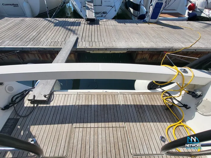  Yacht Photos Pics Stern view of 2008 Hanse 400 yacht docked at marina with wooden deck.