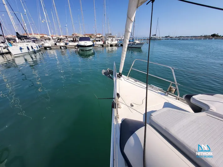  Yacht Photos Pics Sailboat Hanse 400 (2008) docked in a marina with calm waters and clear skies.