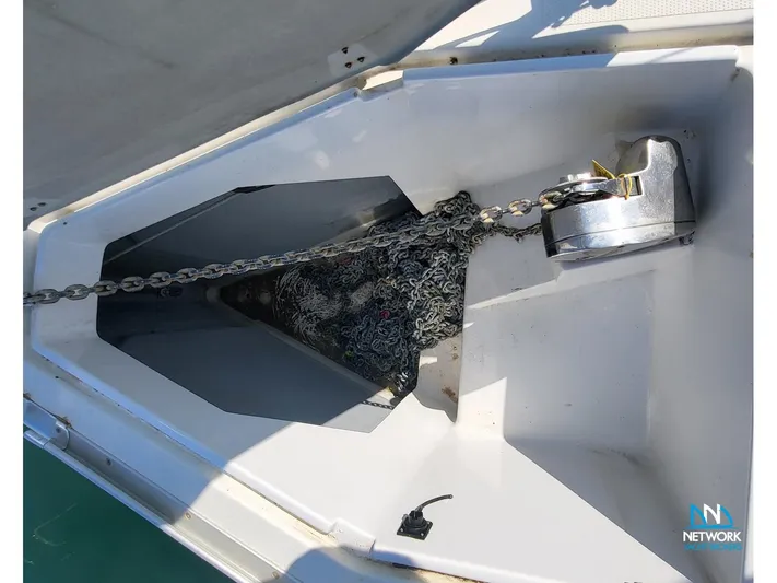  Yacht Photos Pics Anchor chain compartment of 2008 Hanse 400 sailboat, featuring neatly stored chain and anchor.