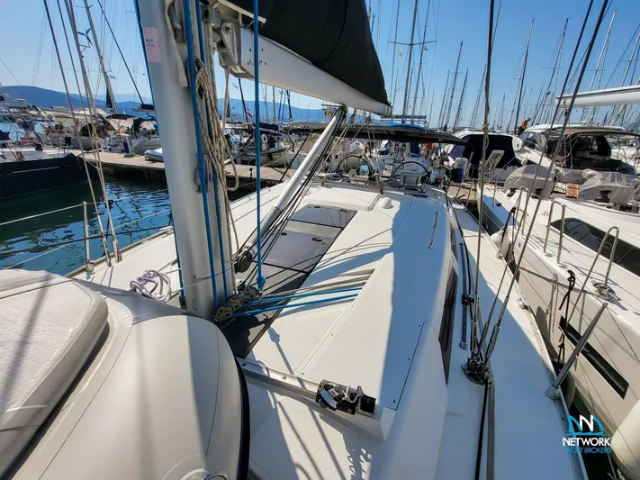  Yacht Photos Pics 2008 Hanse 400 sailboat docked in marina, surrounded by other boats under clear blue sky.