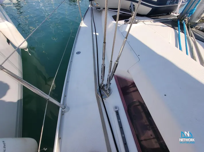  Yacht Photos Pics Deck view of 2008 Hanse 400 sailboat with rigging and water reflection.