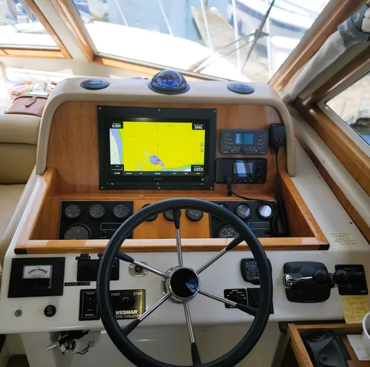Irish Mist 11 Yacht Photos Pics 2003 Navigator 3900 Californian yacht helm with navigation equipment and steering wheel.