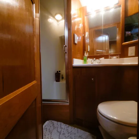 Irish Mist 11 Yacht Photos Pics Bathroom interior of 2003 Navigator 3900 Californian yacht, featuring wood cabinetry and modern fixtures.