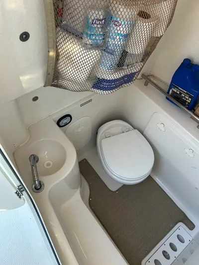  Yacht Photos Pics Interior of a 2018 Sailfish 320 CC with toilet and sink.