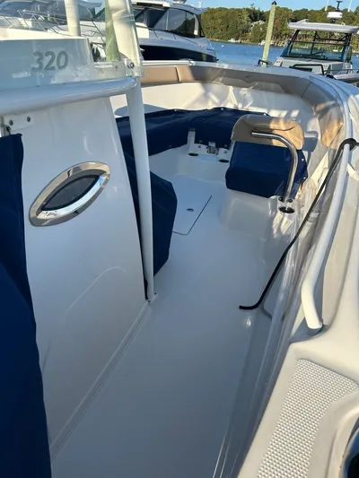  Yacht Photos Pics Interior view of a 2018 Sailfish 320 CC boat with blue seating.